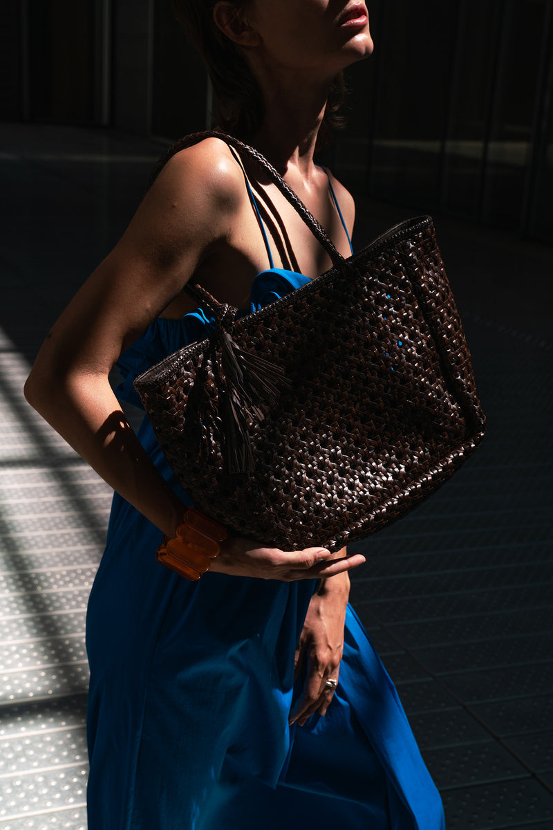 Woman with the Annabelle leather umber bag