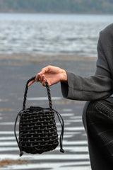  Woman with the Bombolin black leather bag